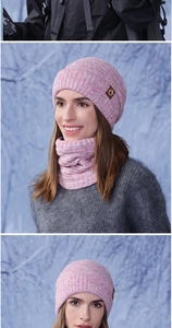 Close-up of pink-purple knit hat and scarf set with thick braided texture for winter
