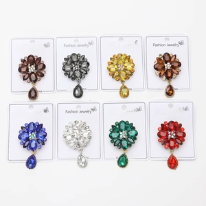 Detailed set of eight vintage-style floral brooches with colorful rhinestones and teardrops