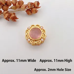 Detail of 11mm gold flower spacer bead with pink opal center and pearls for DIY jewelry