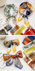 Detailed views of silk-like square scarves showing mint leopard and orange floral patterns