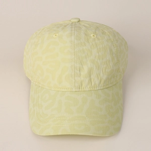 Close-up of leopard pattern texture and stitching details on a stylish baseball cap