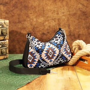 Aztec bohemian crossbody bag with geometric patterns and decorative silver chain