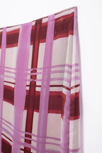 Detail shot of the pink and burgundy plaid fabric texture for this long skirt