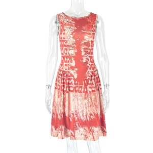 Detail of A-line mini dress featuring red abstract tie-dye print and round neckline