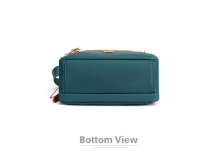 Flat base detail of dark green nylon shoulder bag with brown leather trim details