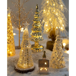 Luminous glass Christmas tree tabletop decor with warm LED light for holiday home setting
