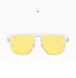 Detail view of large square clear yellow resin sunglasses frame with transparent lenses