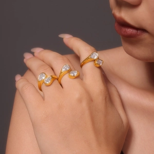 Three 18k gold-plated titanium steel rings with pear-shaped cubic zirconia on model hands