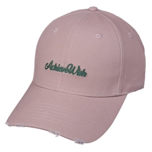 Pink cotton baseball cap with green Achieve Wish embroidery and distressed brim detail