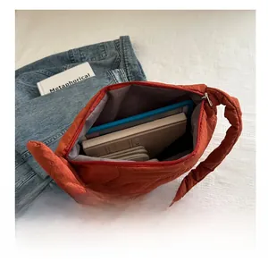 Top view of spacious quilted puffer tote bag interior showing large capacity for essentials