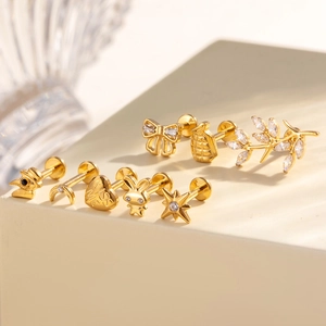 Titanium piercing jewelry set in gold finish with star, moon and heart shaped studs
