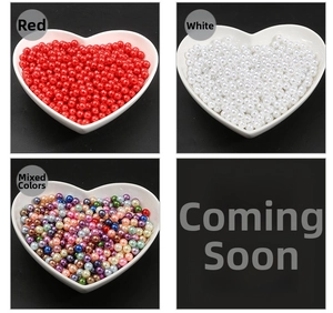 Mix of colorful 3-10mm ABS imitation pearls for DIY crafts in a heart-shaped ceramic dish
