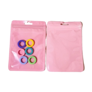 Colorful silicone rings set in pink resealable packaging bag for jewelry storage