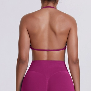 Detail of seamless purple halter sports bra and high waist leggings showing back design