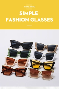 Detailed flat lay of trendy oversized cat eye sunglasses in various colorful frame options