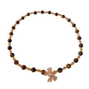 Tiger eye beaded necklace with gold butterfly pendant and sparkling zircon accents