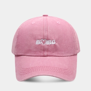 Pink washed cotton baseball cap with white mama heart embroidery and curved brim