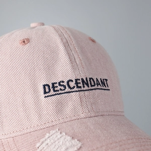 Pink distressed baseball cap with Descendant embroidery and vintage frayed brim detail