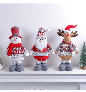 Detail showing plush Christmas characters including Santa, snowman, and reindeer on a mantel