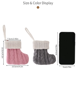 Detailed size comparison of pink and grey cable knit mini Christmas stockings