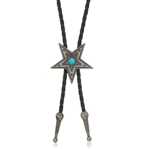 Detail of vintage star bolo tie with turquoise stone and braided leather cord tips