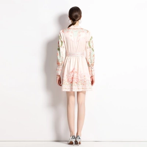 Back view of a retro floral V-neck long-sleeve midi dress with waist slimming fit