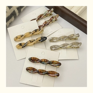 Elegant twisted acetate hair clips in four marble patterns for side bangs styling