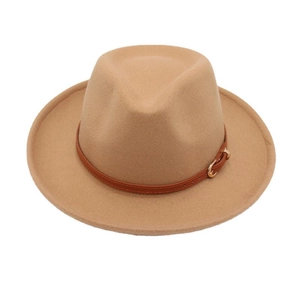 Detail of camel wool fedora hat with a brown leather band and gold metal buckle