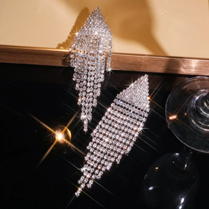 Sparkling silver rhinestone tassel earrings with geometric crystal leaf drops on black
