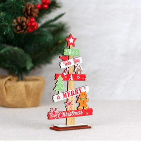 Detail of wooden Christmas tree tabletop decor with We Wish You A Merry Christmas text