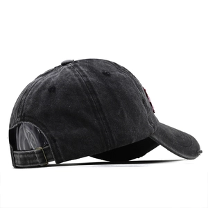 Detail of vintage charcoal grey washed denim baseball cap with adjustable metal buckle