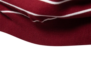 Detailed close-up of high-density red and white striped knit fabric texture and ribbing