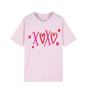 Pink oversized cotton T-shirt featuring a colorful XOXO heart graphic for Valentine's Day