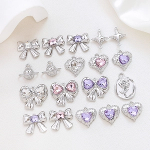 Silver alloy jewelry pendants with pink heart, bow and planet charms for DIY crafting