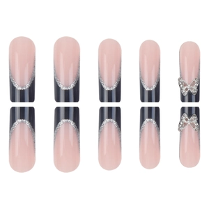 Long French press-on nails in nude pink and dark blue with 3D butterfly rhinestones