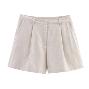 Detail of beige linen blend shorts featuring pleated front and side pockets