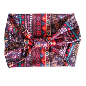 Bohemian paisley yoga headband with knot design in vibrant floral ethnic prints