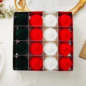 Set of 16 red green and white flocked Christmas ornaments in a grid gift box packaging