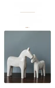 Detailed view of hand-painted white wooden horse set with vintage distressed texture