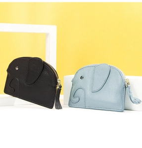 Detail of elephant coin purses in black and blue leather with lychee texture