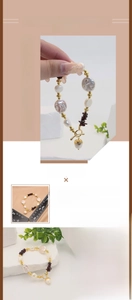 Detailed macro view of baroque pearl bracelet with garnet beads and acorn charm