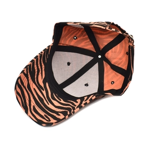 Interior view of orange and black zebra print cotton baseball cap with seam details