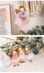 Detail of plush angel Christmas ornaments with fur and mesh skirts in multiple colors