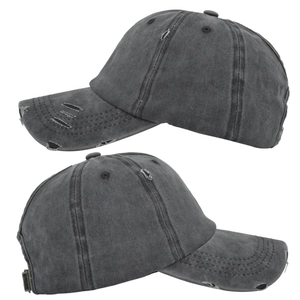 Close-up of distressed ponytail baseball cap featuring washed dark grey cotton canvas details