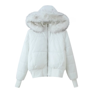 Close-up of white puffer jacket featuring a fluffy detachable grey and white fur hood trim