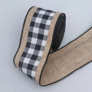 Close-up of black and white plaid faux linen ribbon with stitched edges for DIY crafts