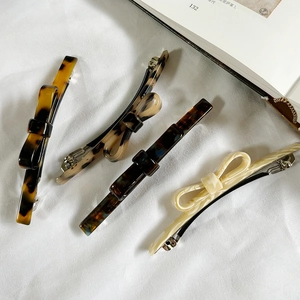 French style acetate bow hair clips in tortoiseshell and marble patterns set of four