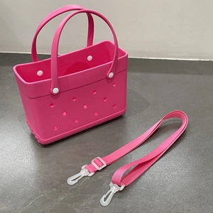 Detailed top view of pink EVA beach bag with holes and matching removable strap