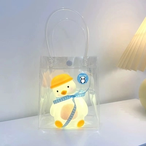 Luminous duck night light in clear PVC gift bag with blue ribbon and panda sticker