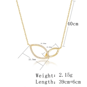 Detail showing gold diamond interlocking rings pendant with specific size measurements